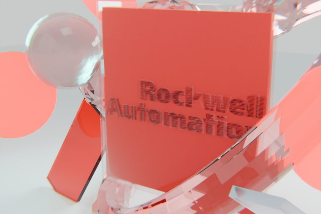 Rockwell automation logo on a red block with abstract shapes